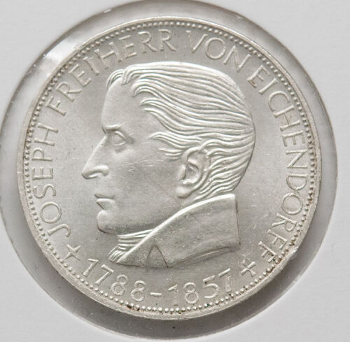 Vorderseite der 5-DM-Silbermünze 1957 mit dem Porträt von Joseph Freiherr von Eichendorff nach links. Klare Konturen und sauberes Schriftbild.