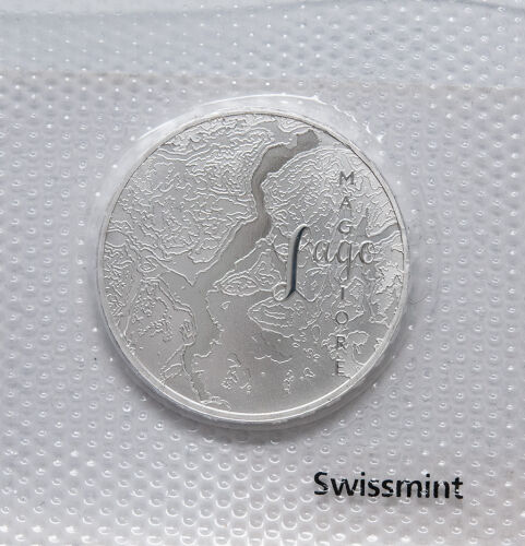 Münze Schweiz 20 Franken 2025 „Lago Maggiore“ Stempelglanz – Vorderseite zeigt Seeansicht, Rückseite Symbol Wasserturm Europa.