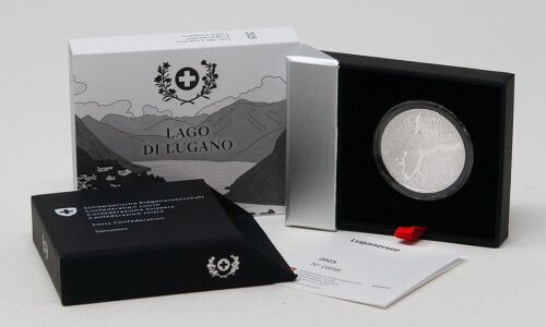 Münze Schweiz 20 Franken 2025 „Lago di Lugano“ Polierte Platte – Vorderseite zeigt den See in Vogelperspektive, Rückseite Symbol „Wasserturm Europas“.